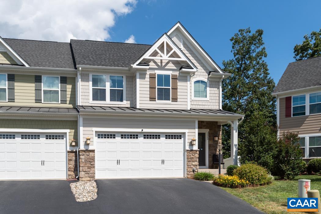 a front view of a house with a garage