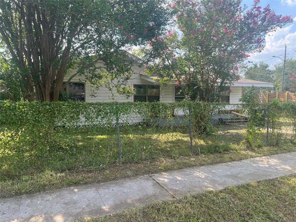 a backyard of a house with fountain and barbeque oven