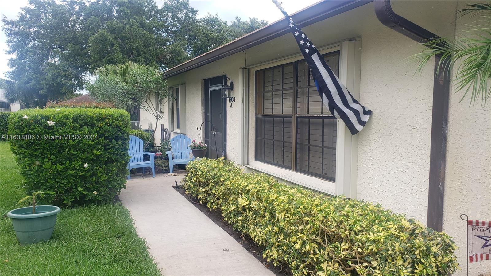 a house with a flower garden in front of it