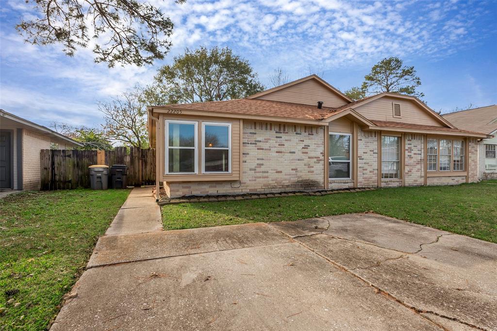 front view of a house and a yard