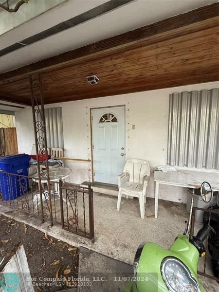 a view of a chairs and table in patio