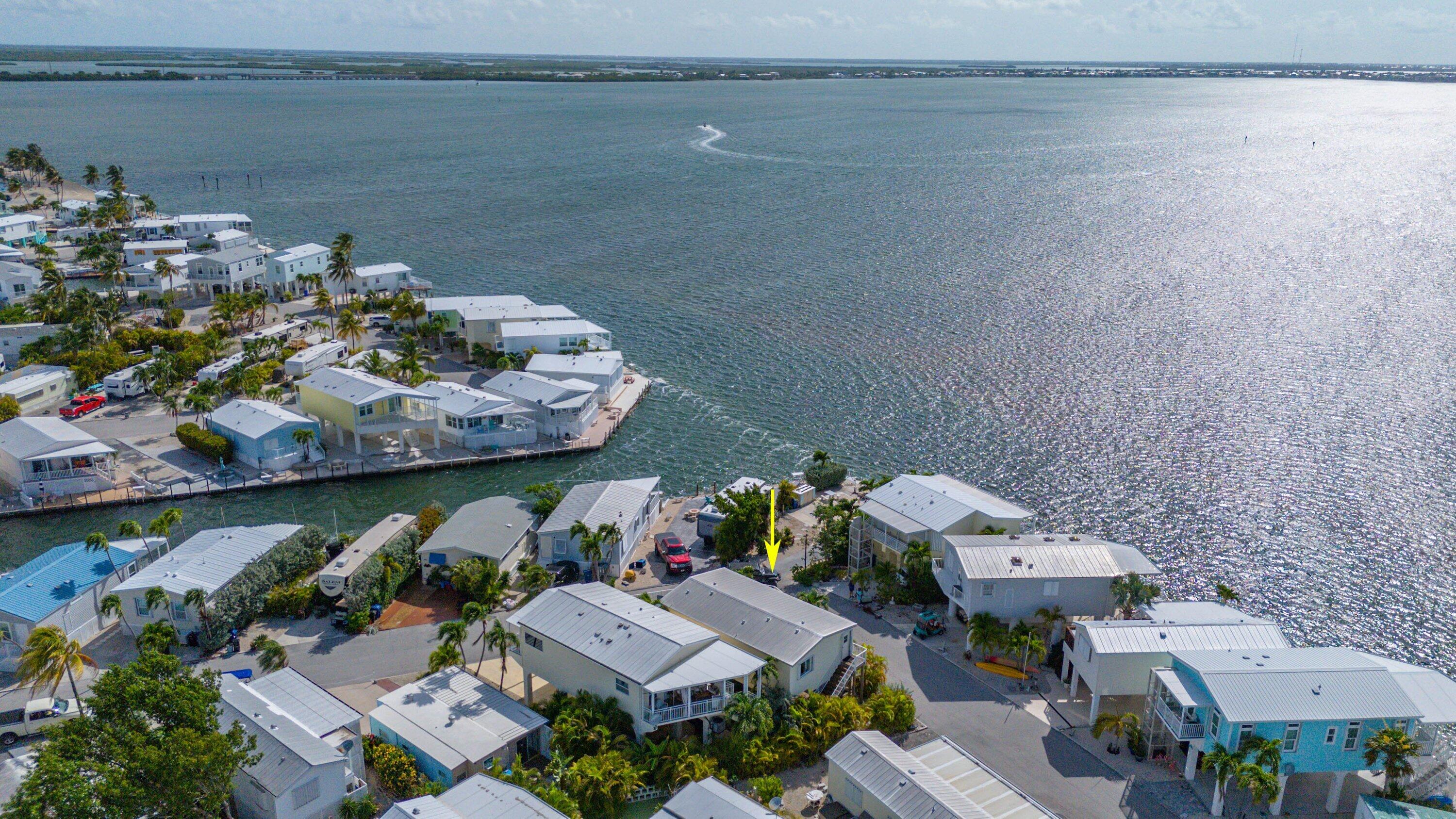 an aerial view of a house with a lake view