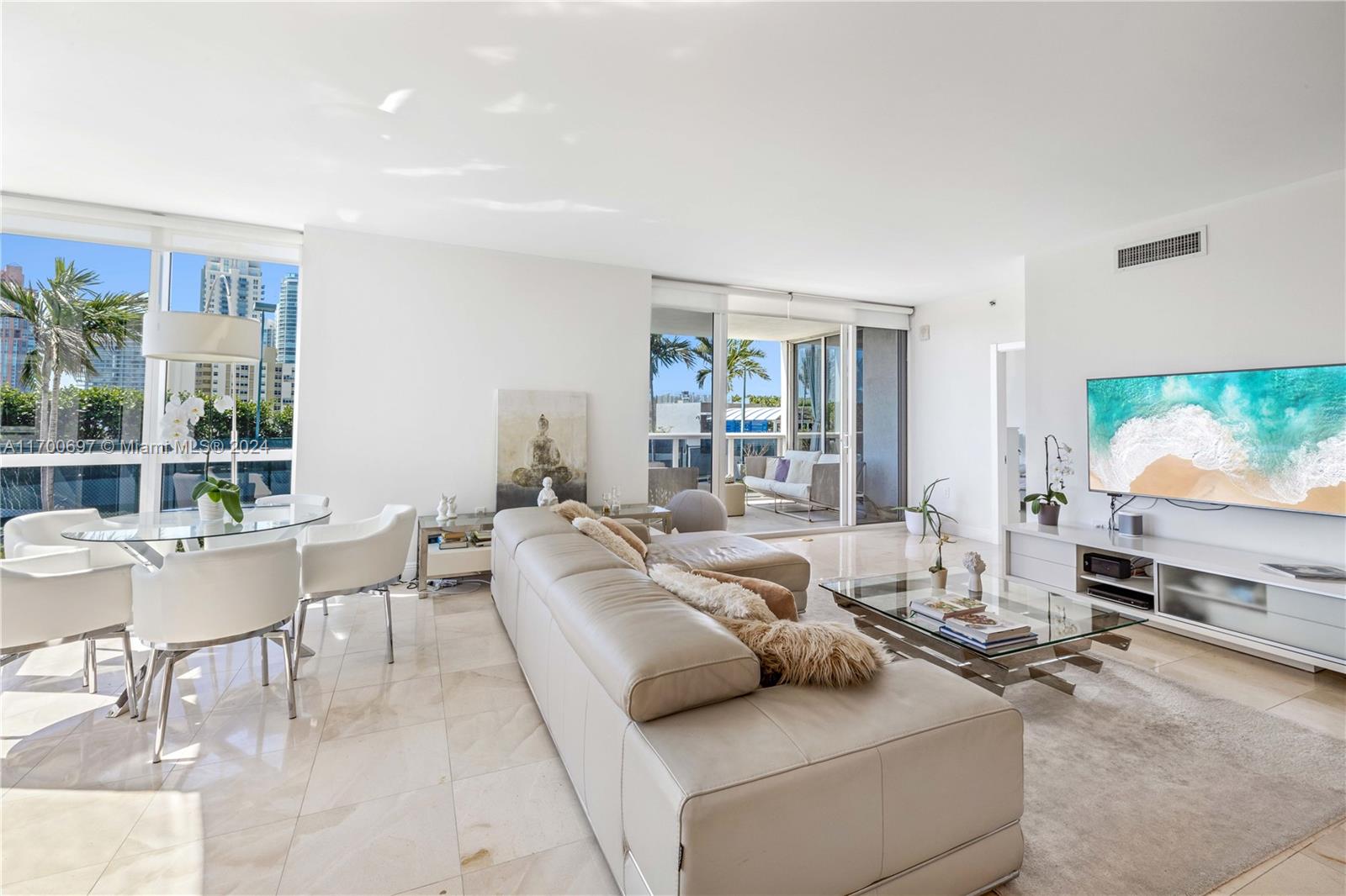 a living room with furniture and a flat screen tv