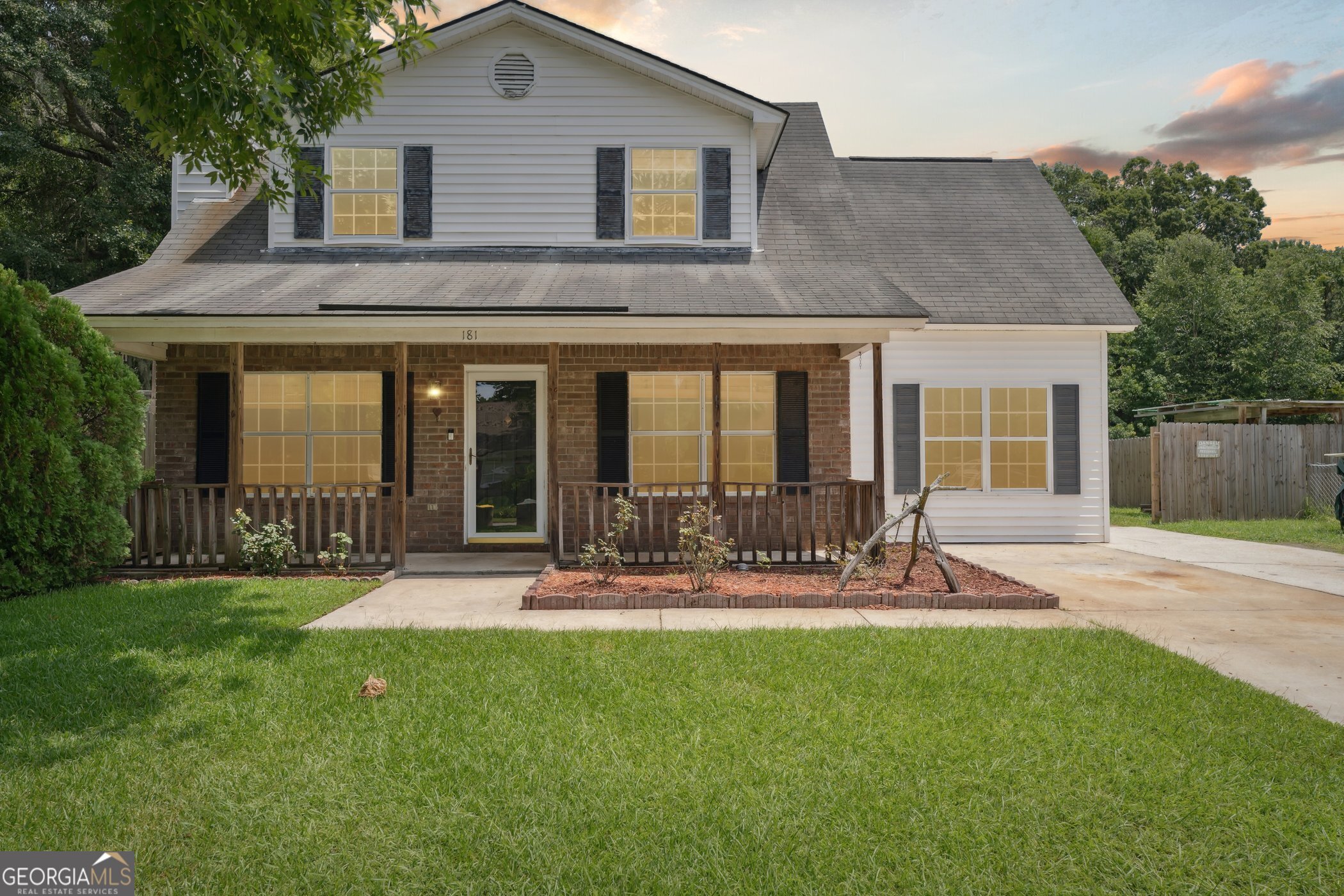 a front view of house with yard and outdoor seating