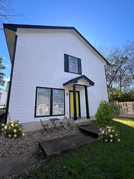 a front view of a house with garden