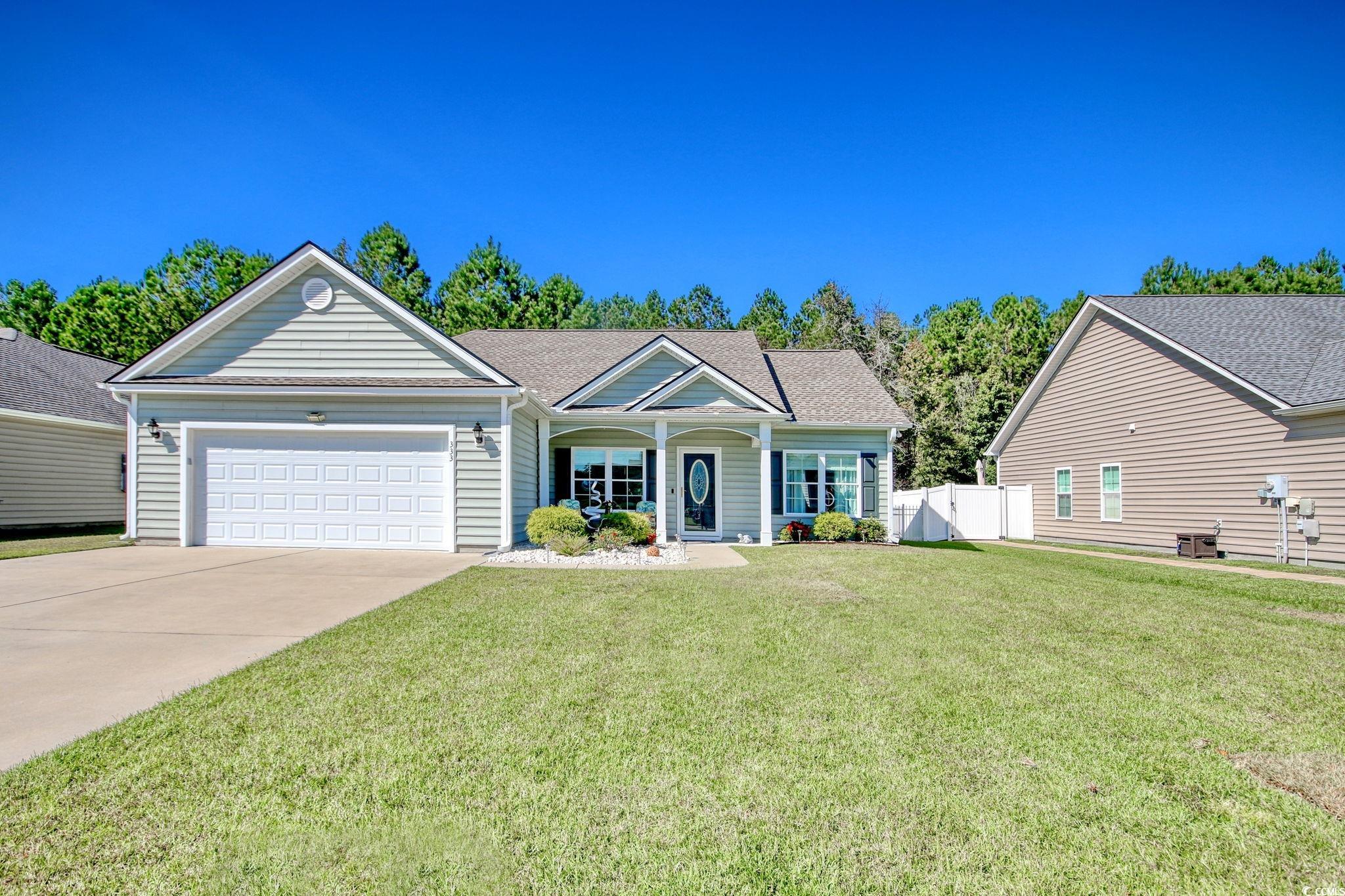 View of front of house featuring a garage and a fr