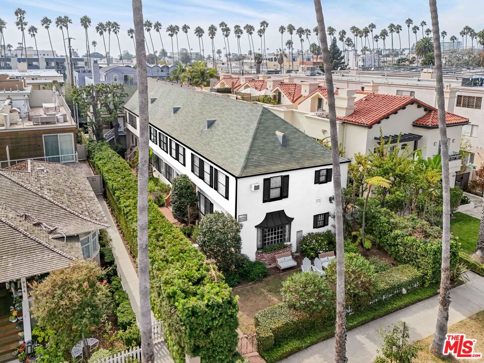 a aerial view of a house with a yard and deck