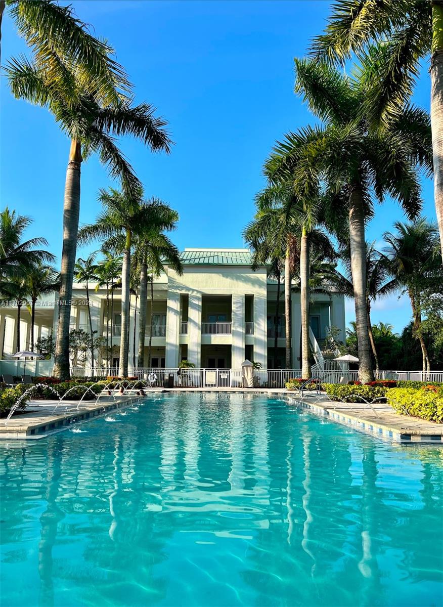 a swimming pool with outdoor seating and yard