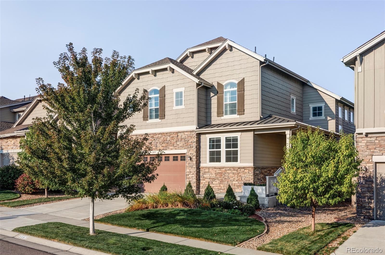 a front view of a house with a yard