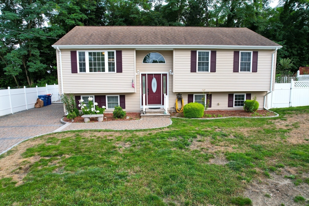 a front view of a house with a yard