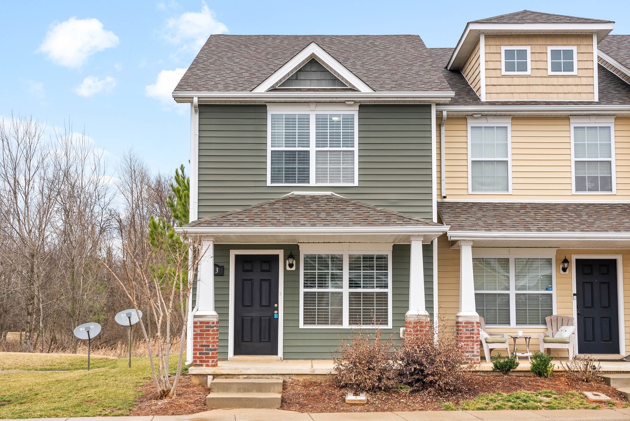 a front view of a house with garden