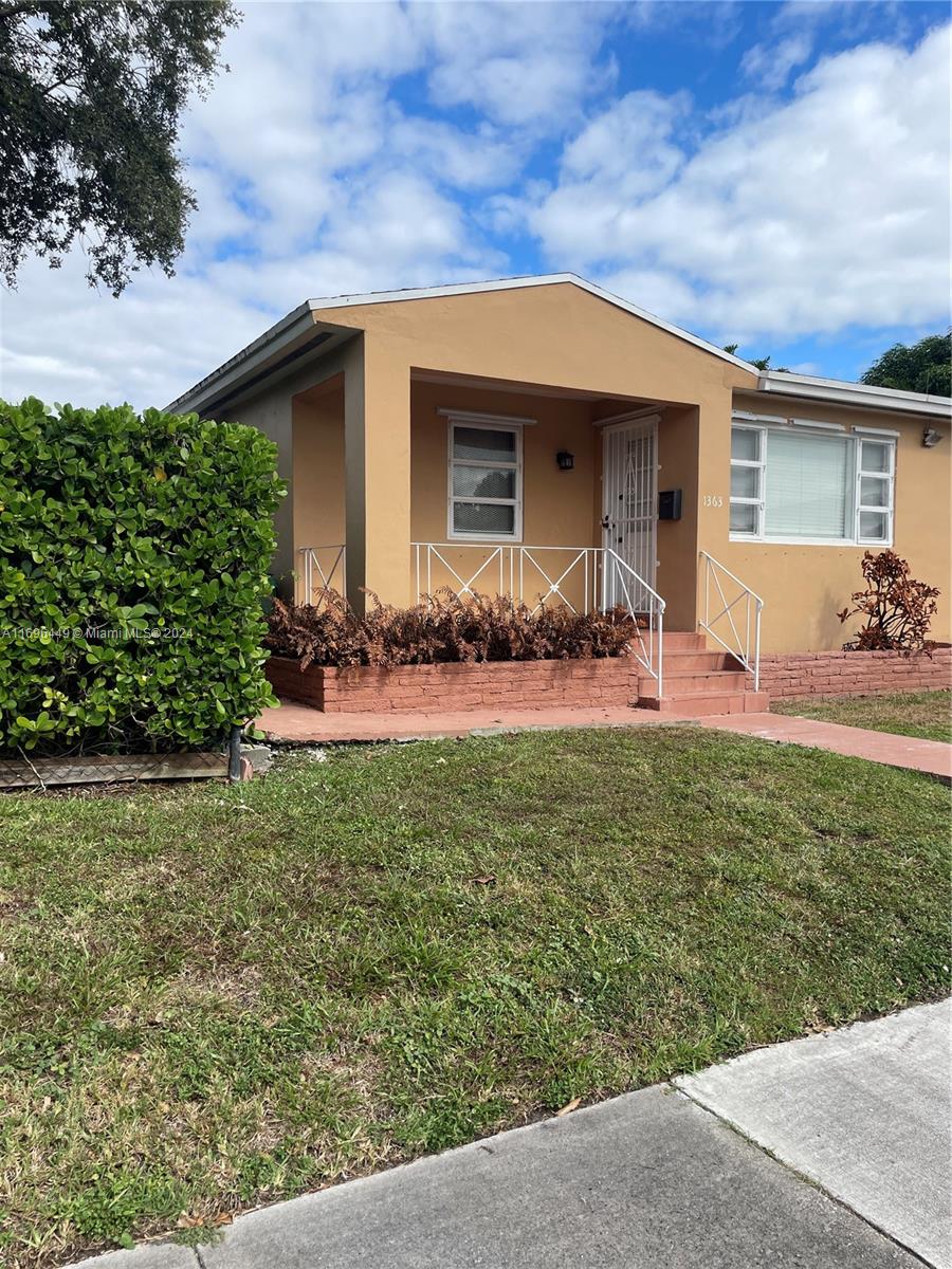 front view of a house with a yard