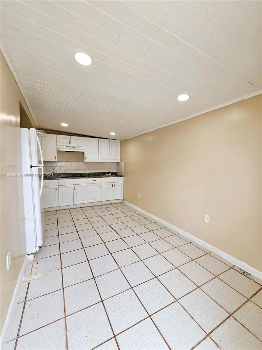 a view of a kitchen with a sink