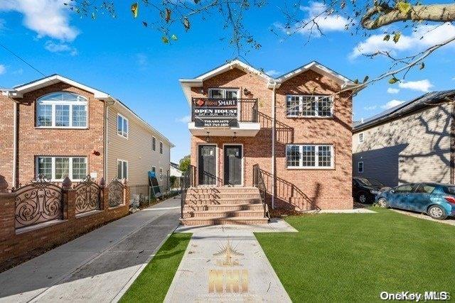 a front view of a house with a yard