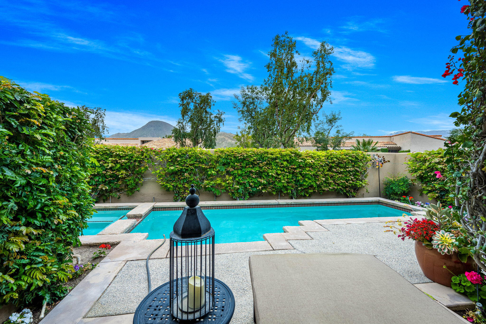 a view of a garden with a patio