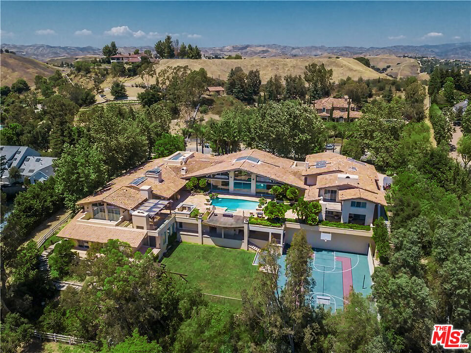 an aerial view of a house with a garden