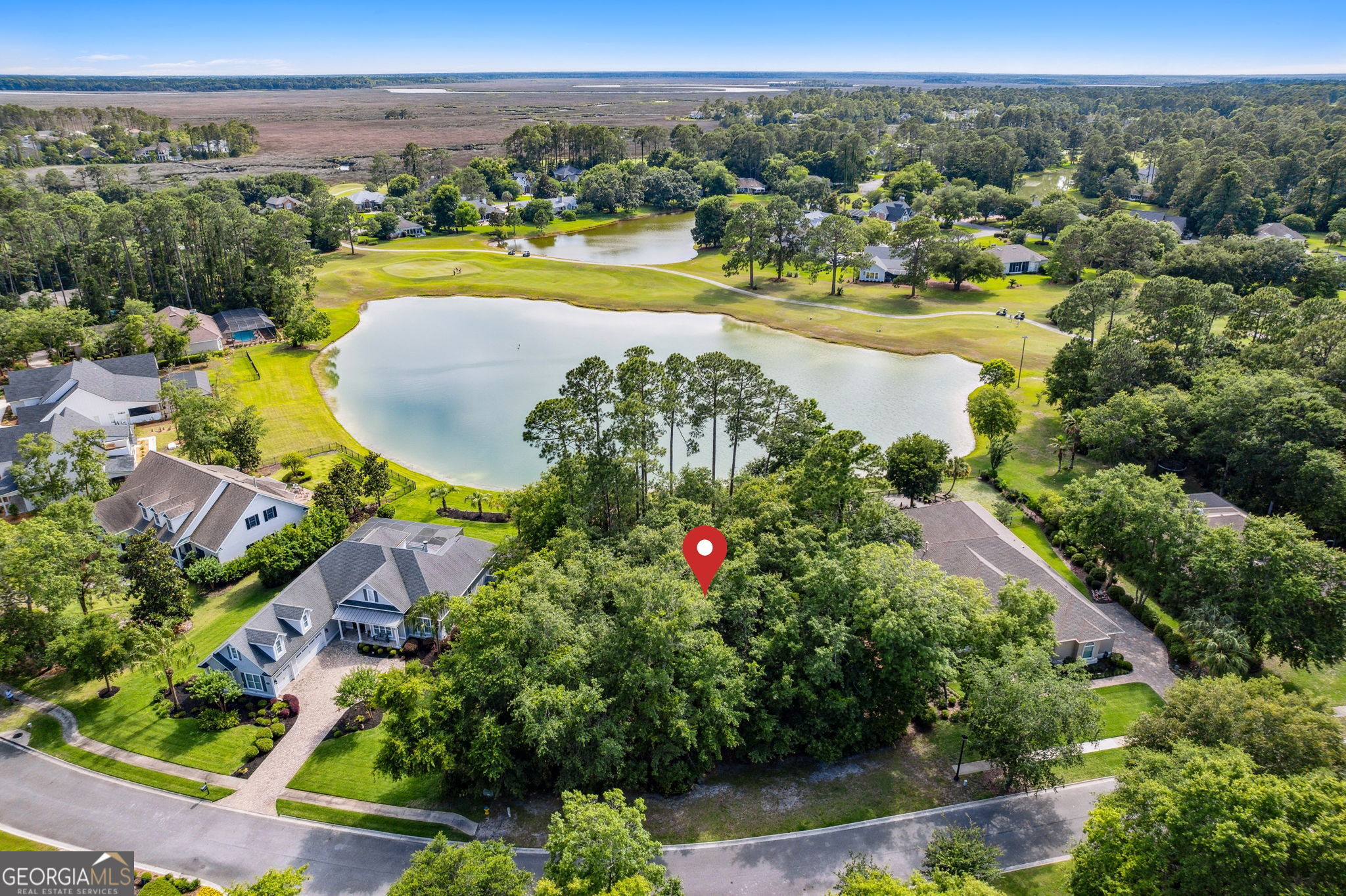 an aerial view of a house with a swimming pool yard and outdoor seating