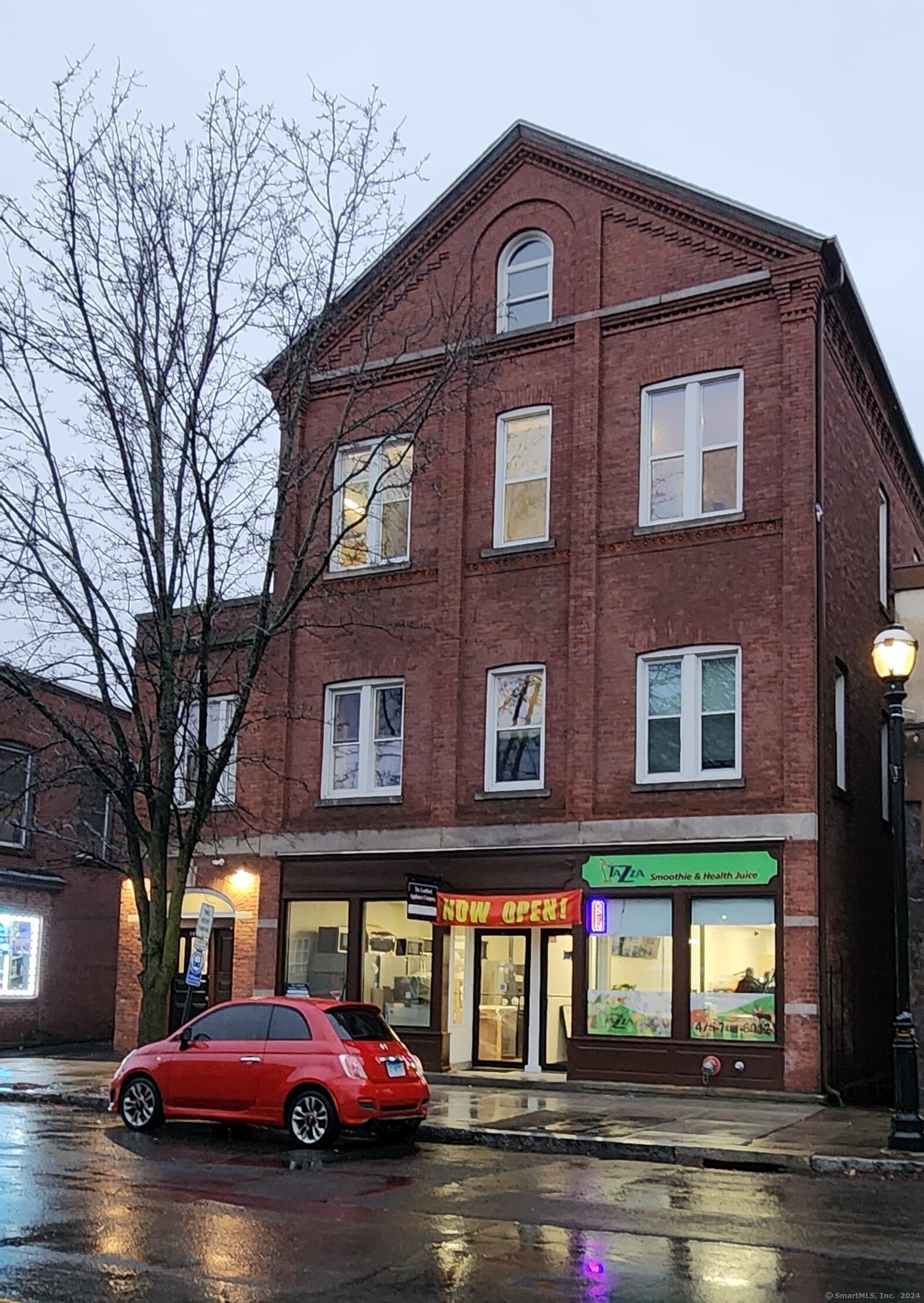 a red brick building that has lots of windows on it