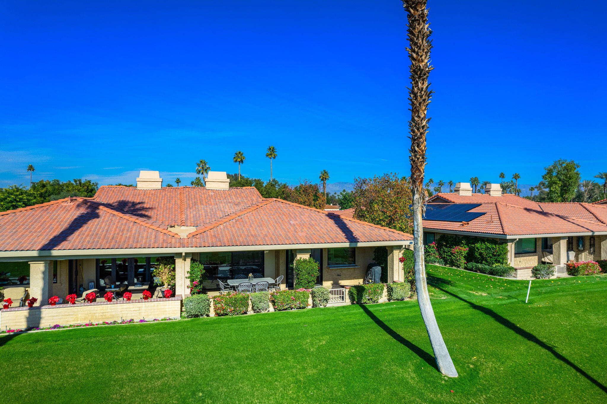 a view of a house with a yard porch and sitting area