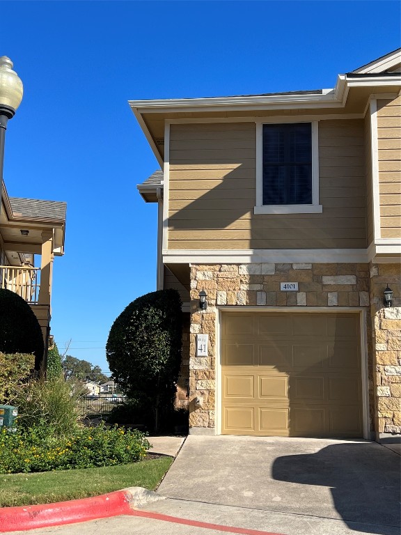 a front view of a house with a garage