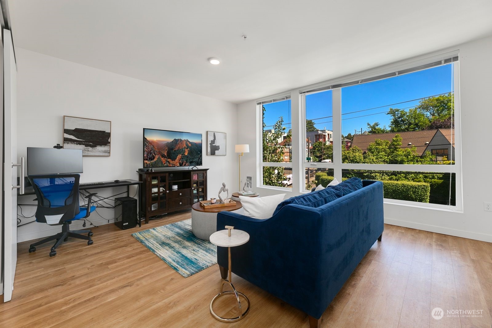 a living room with furniture and a flat screen tv