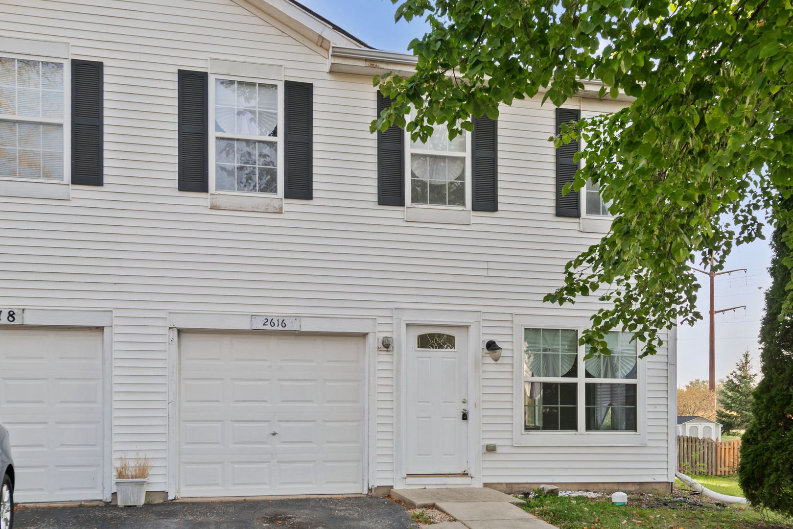 a front view of a house with garage