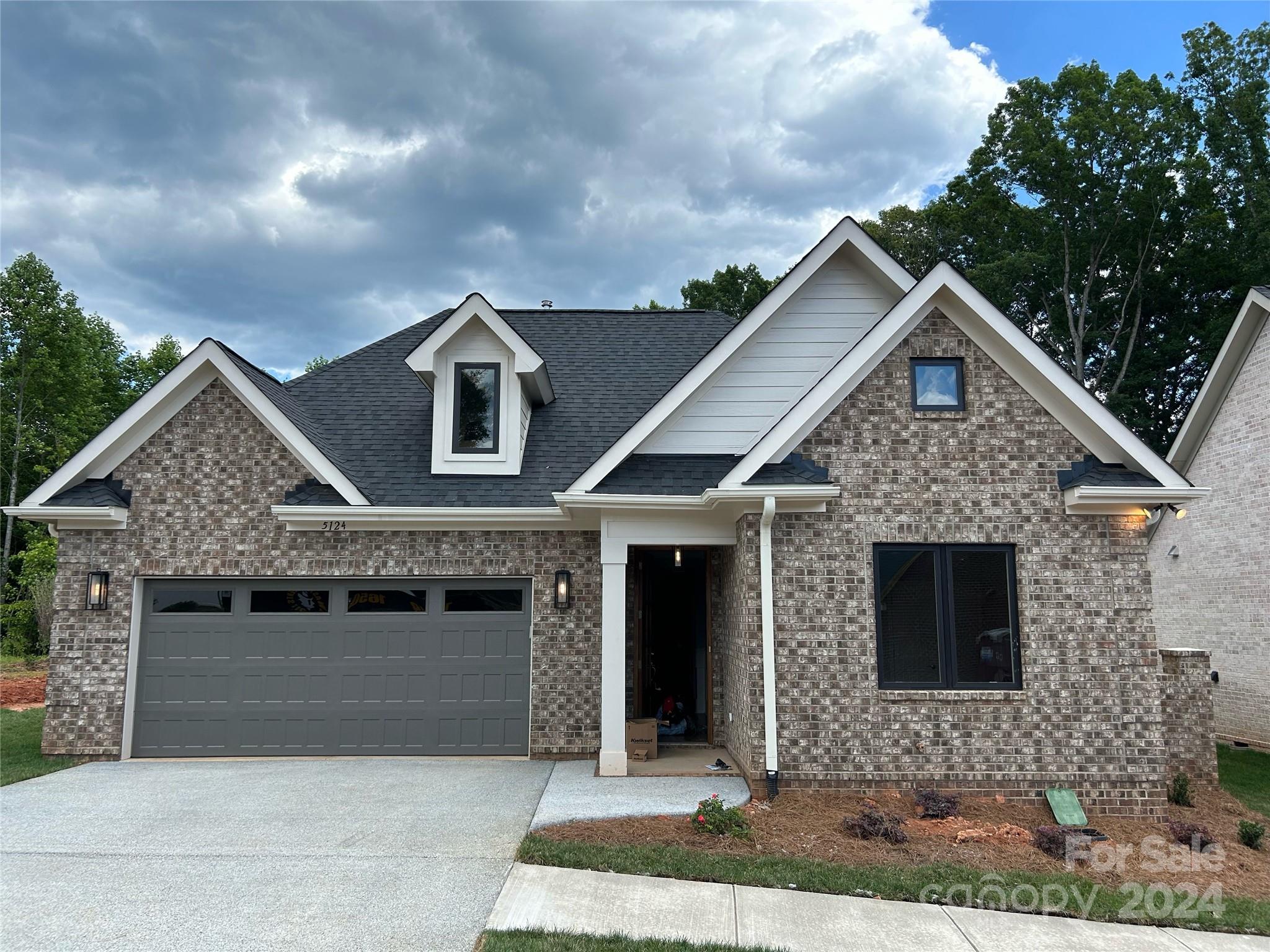 a front view of a house with yard