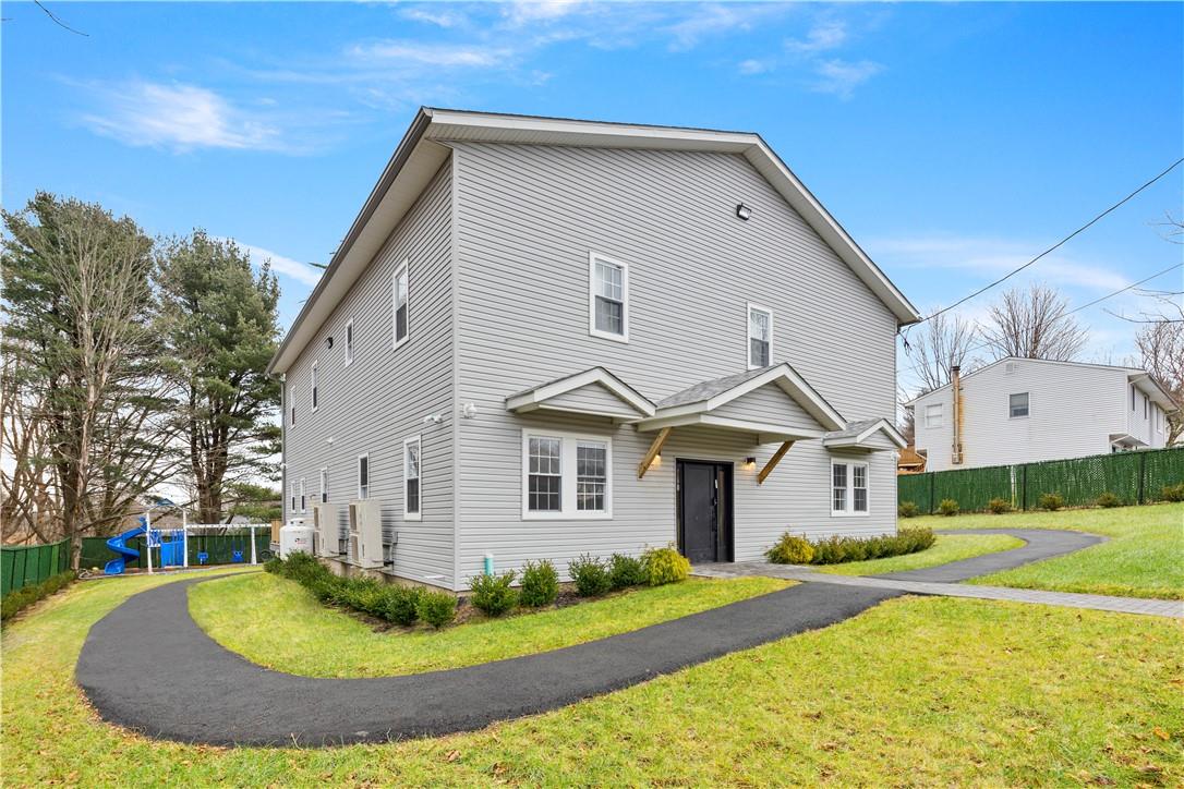 a front view of a house with a yard