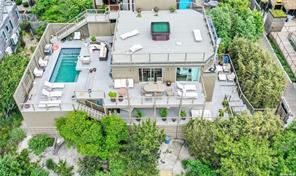 an aerial view of a house with a garden and plants