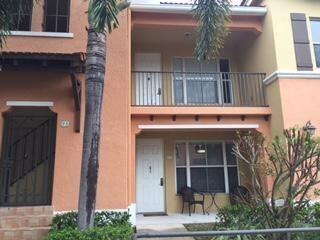 a view of small house with palm tree