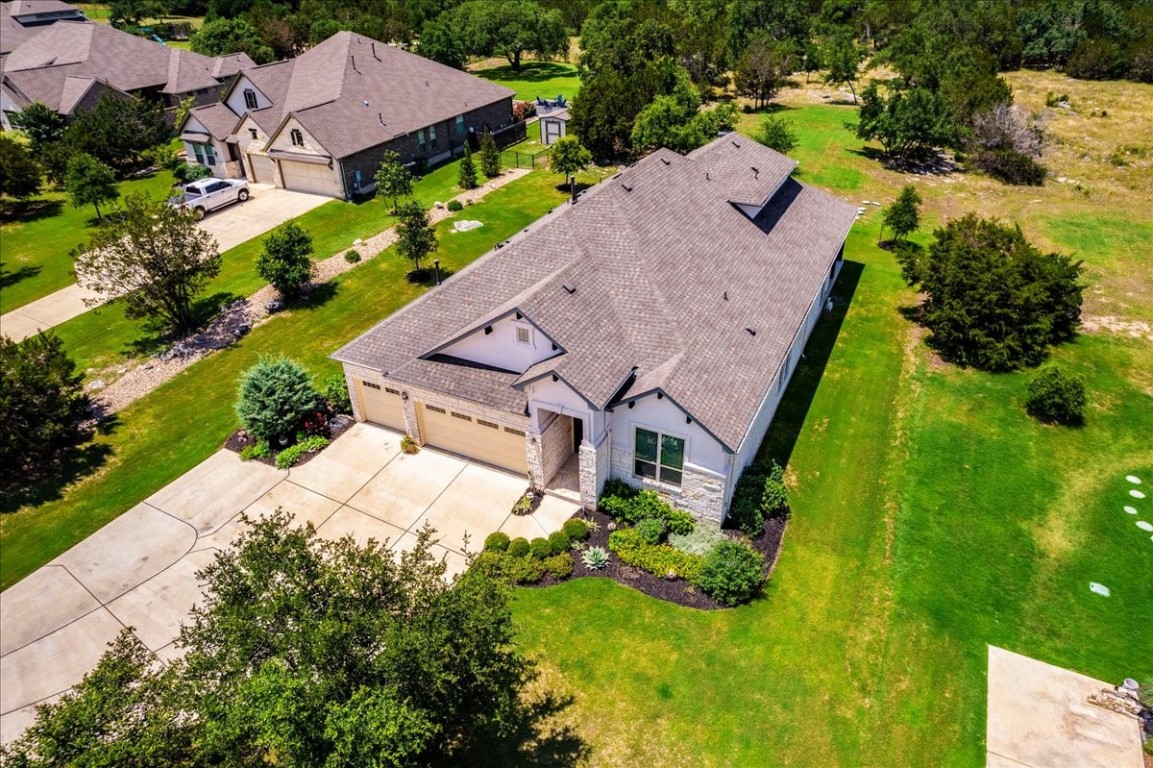 an aerial view of houses with yard