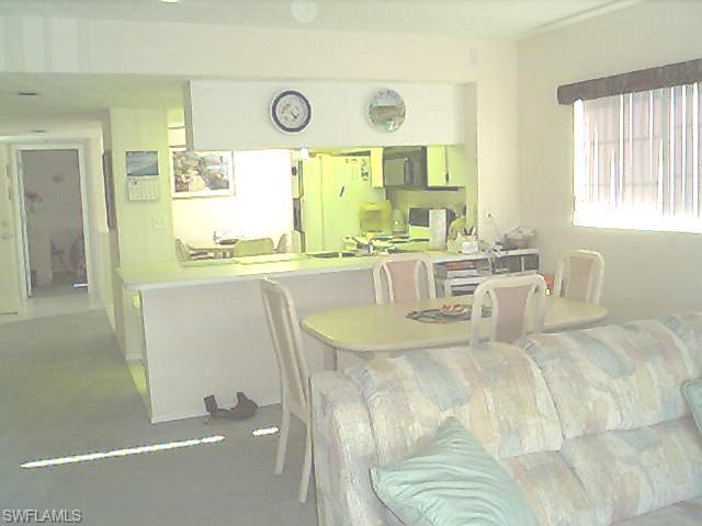 a room with counter top space and windows