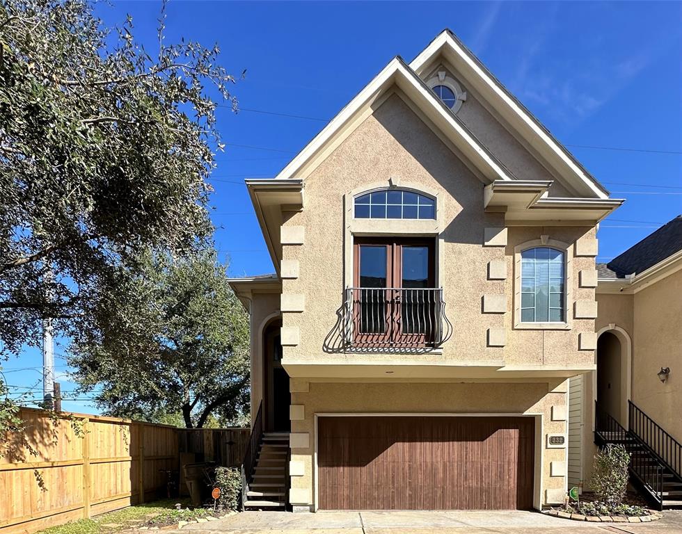 a front view of a house with a garage