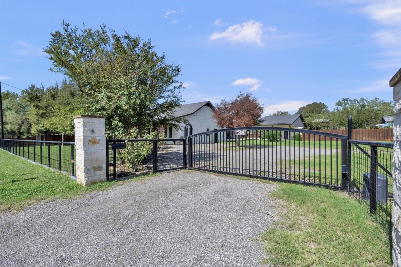 a view of a wrought iron fences in front of house