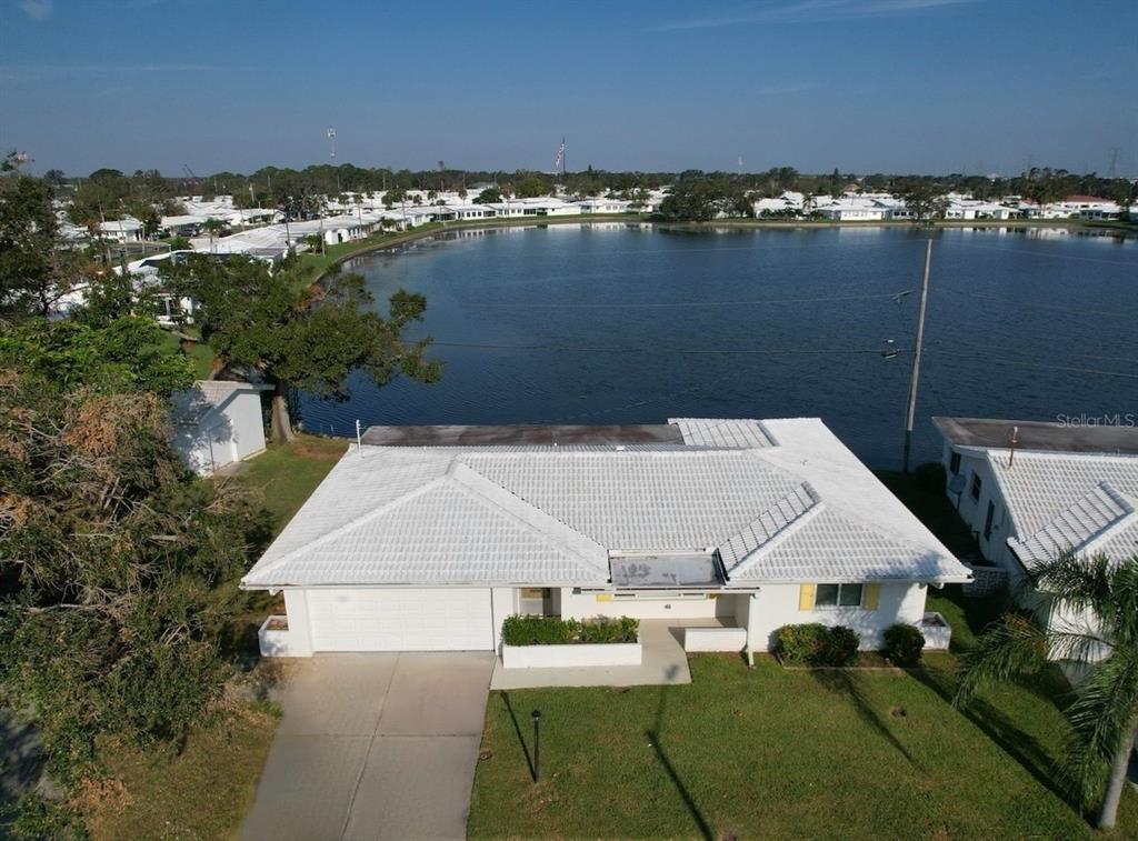 an aerial view of a house with a yard