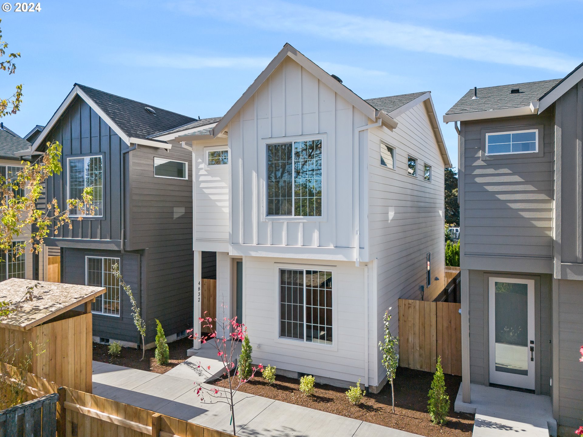 a front view of a house with garage