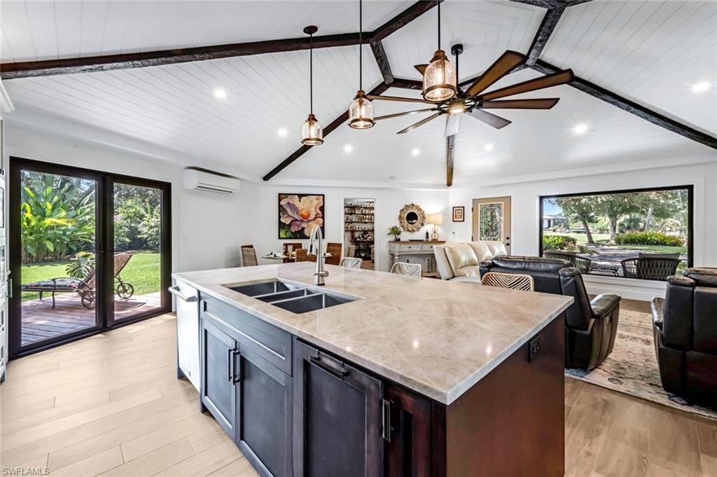 The large kitchen island is the centerpiece of the great room. Friends and family will create lasting memories in this space.