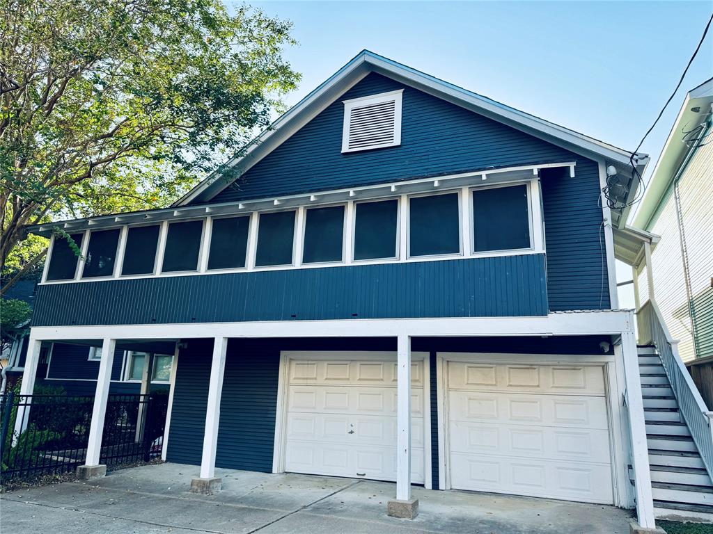 a front view of a house with a garage