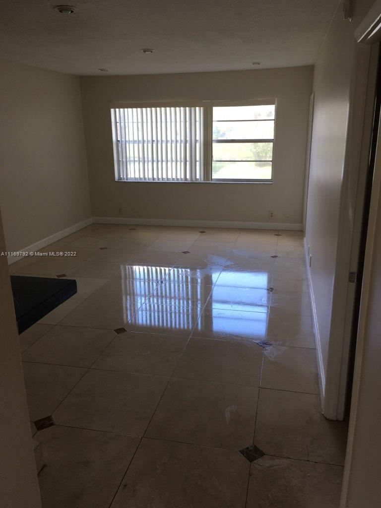 view of a livingroom with a floor to ceiling window