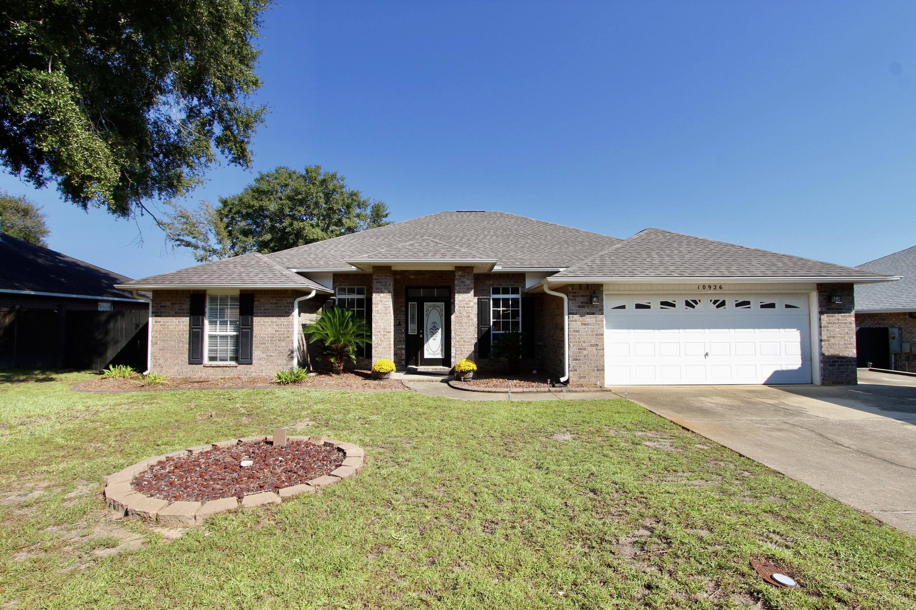 a front view of a house with yard