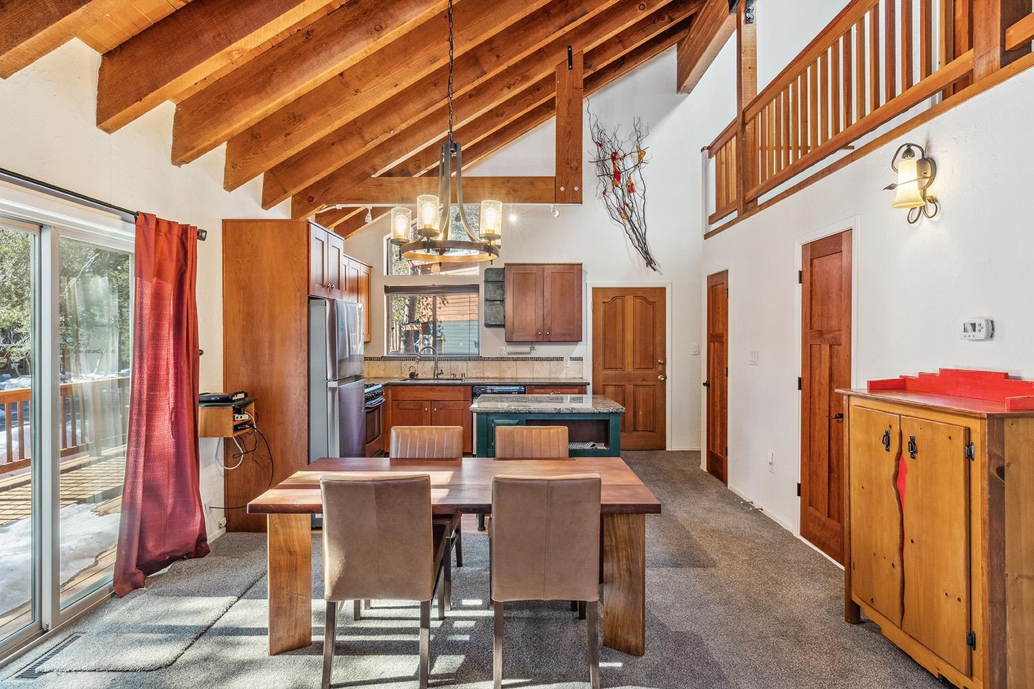 a dining room with furniture and a rug