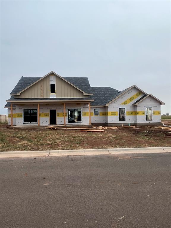 a front view of a house with a street