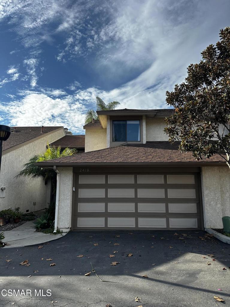 a view of a house with a garage