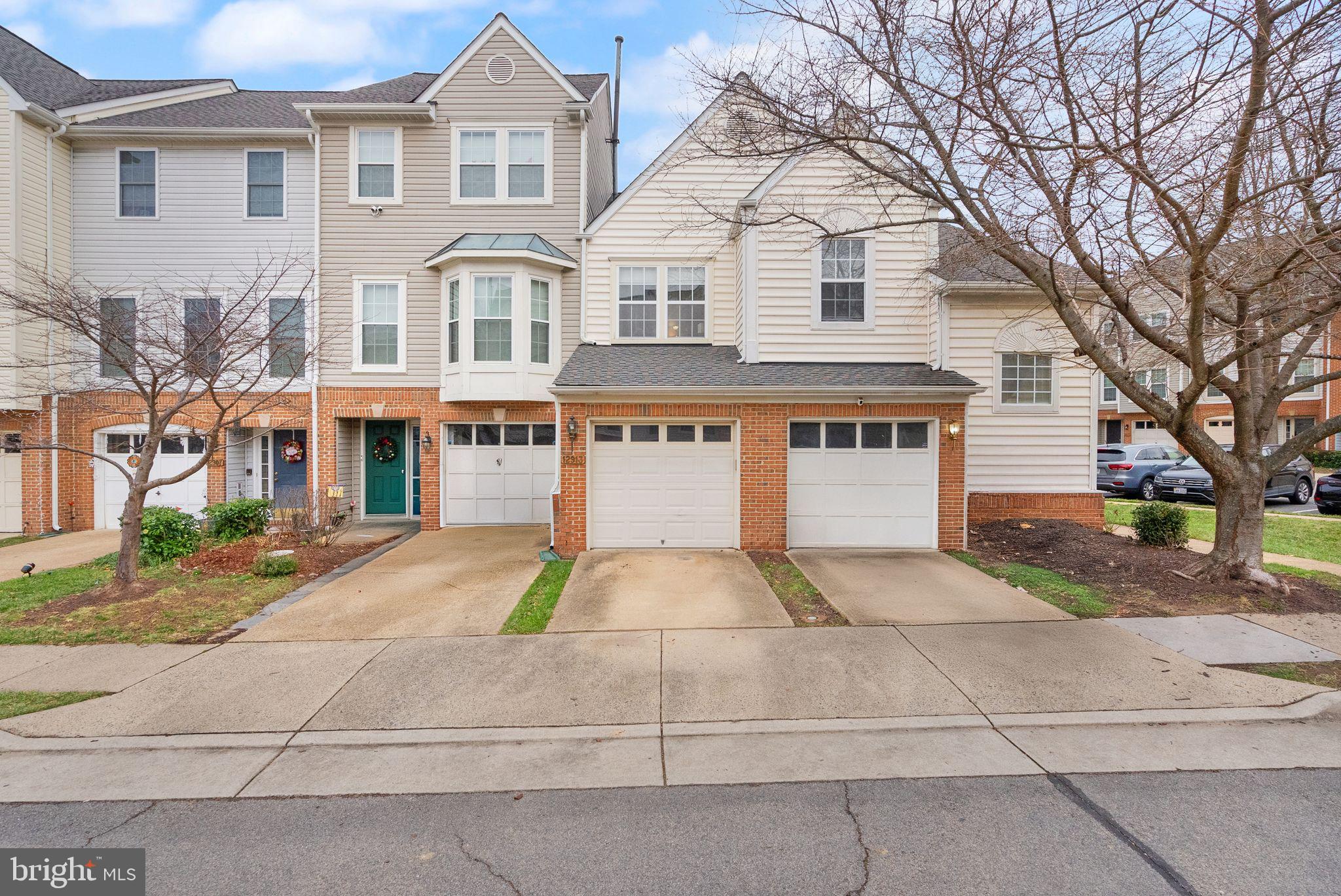 single car garage on left with one driveway space