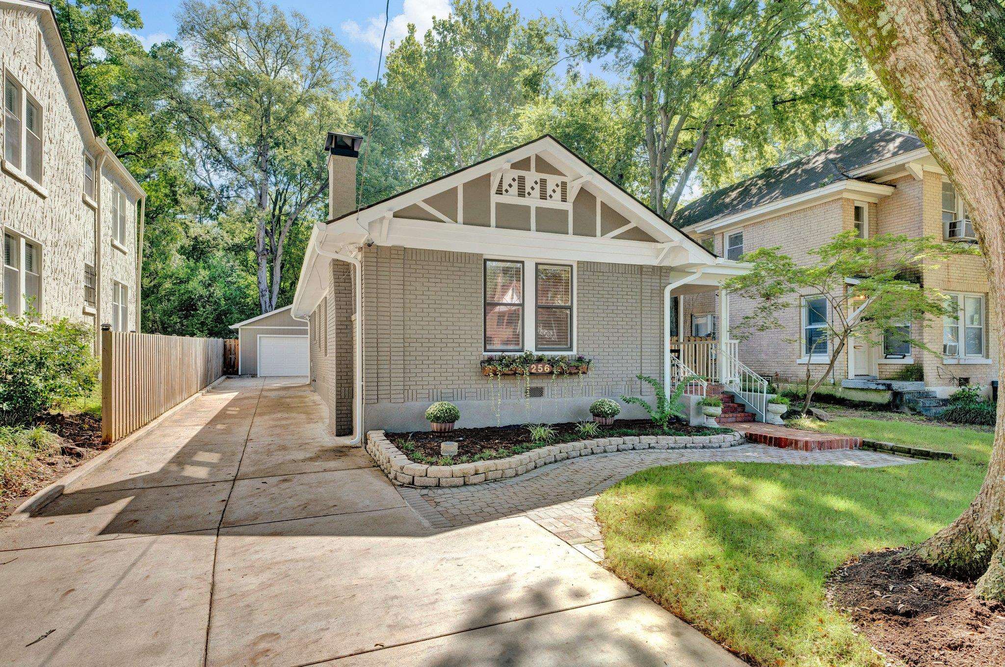 a front view of house with yard outdoor seating and barbeque oven