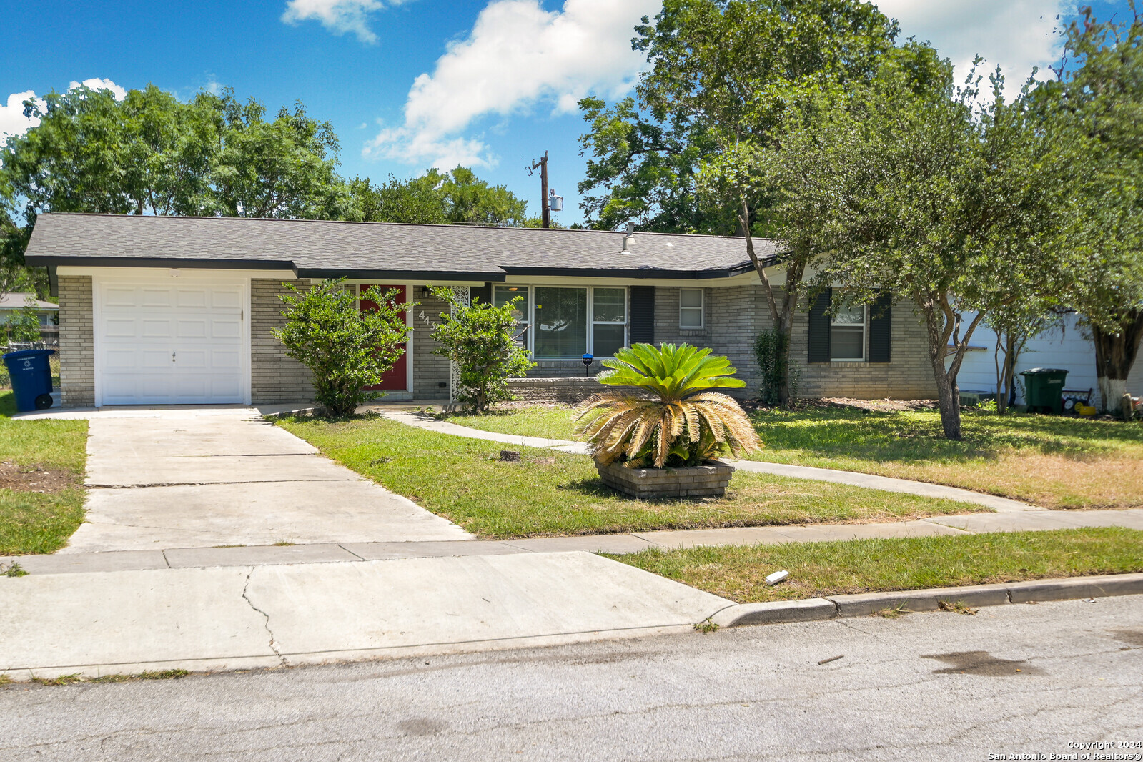 front view of a house with a yard