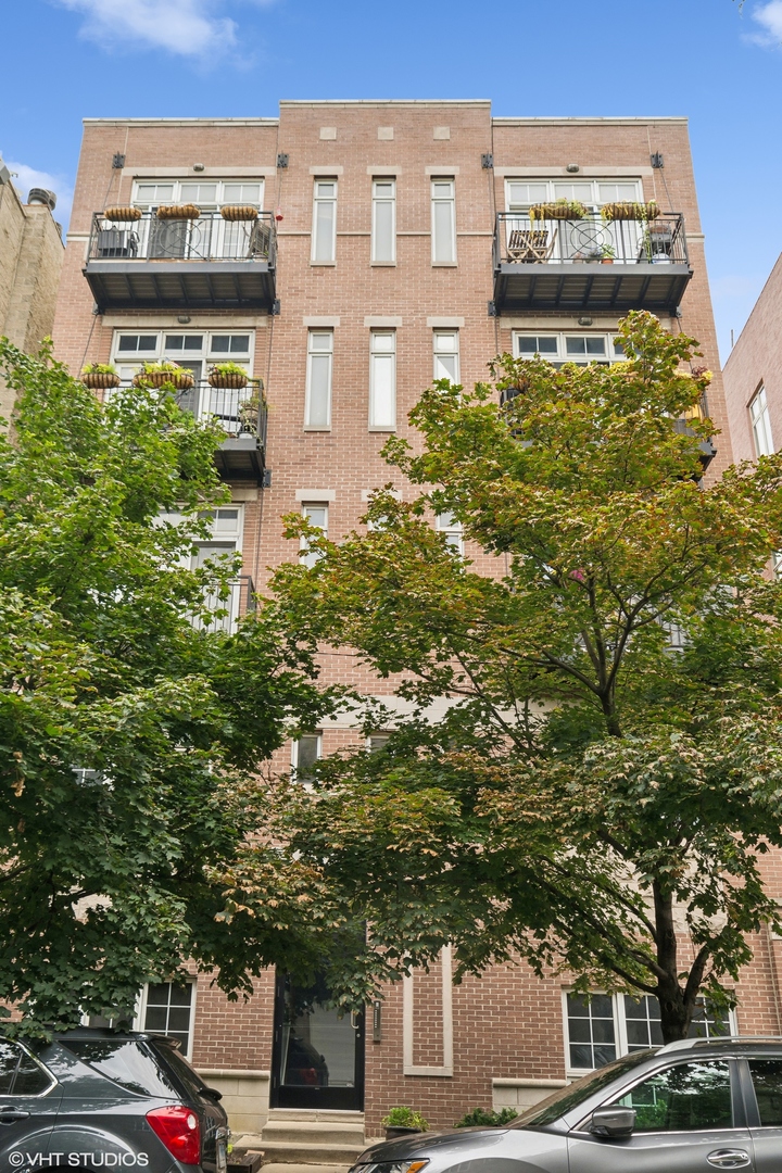 a front view of a building with garden