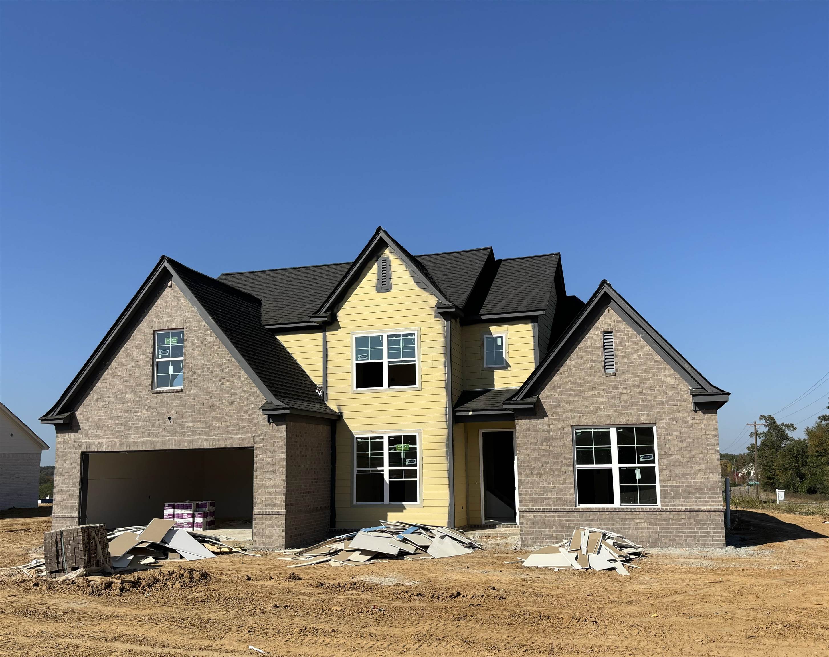 a front view of a house with yard