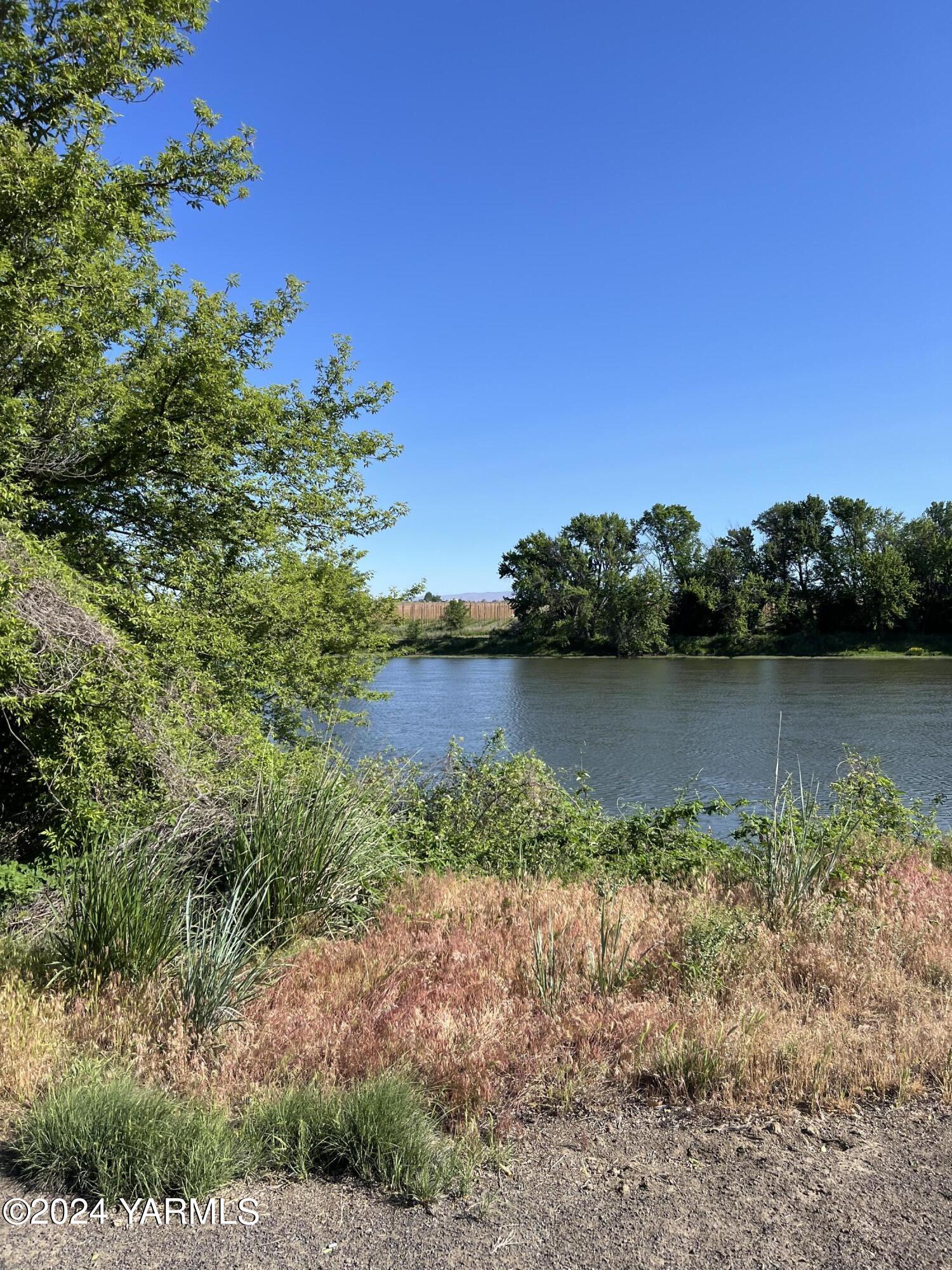 a view of lake with green space