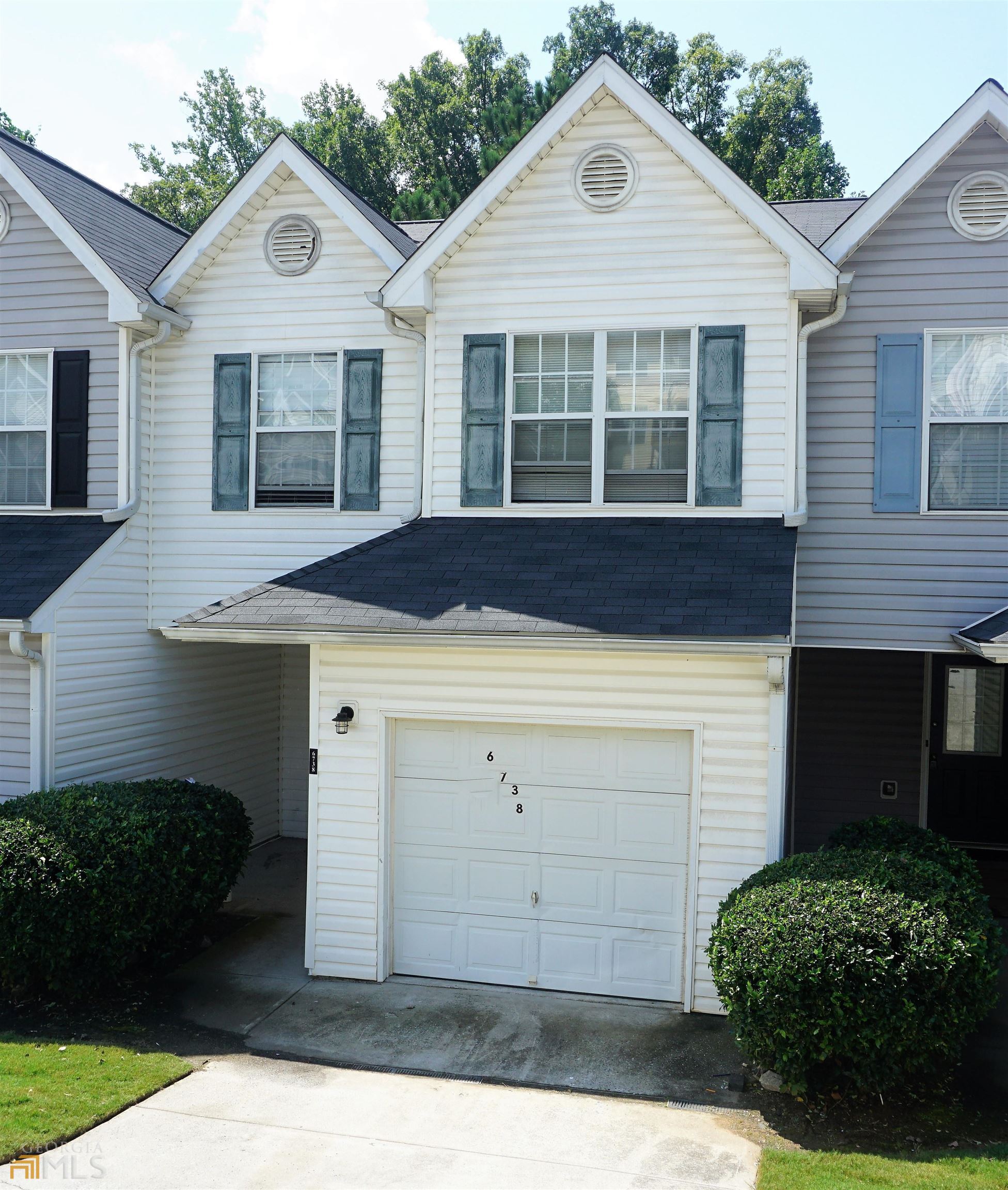 a view of house with yard